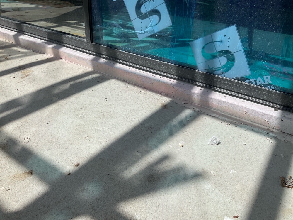Window rubber flashings not seated between window and cladding, found during a lock-up inspection in Clyde