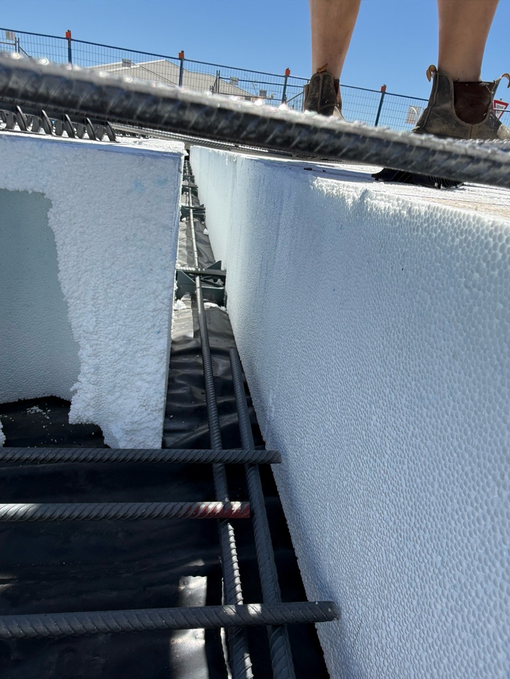 Middle rib reinforcement not fully tied before the pour, found during a slab pre-pour inspection in Clyde North